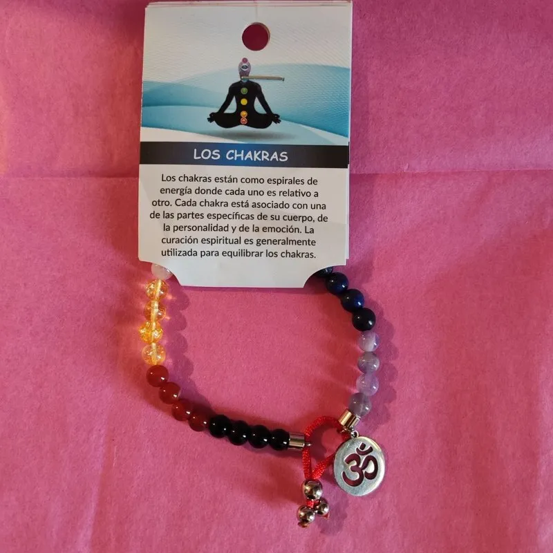 PULSERA ELASTICA DE LOS CHAKRAS EN 6 MM Y ADORNOS DE ACERO INOXIDABLE Y DIJE DE OM